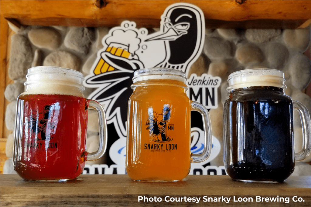1200x800 photo of mugs of beer at Snarky Loon Brewery on top of the bar