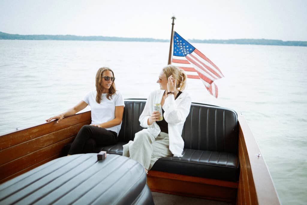 Photo of two women on a boat ride on a lake
