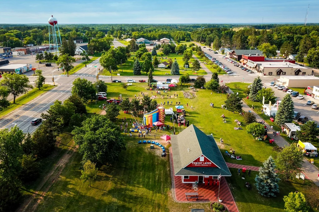 Aerial photo of Pequot Lakes Trailside Park during Stars & Stripes Days with a festival happening on a sunny summer day