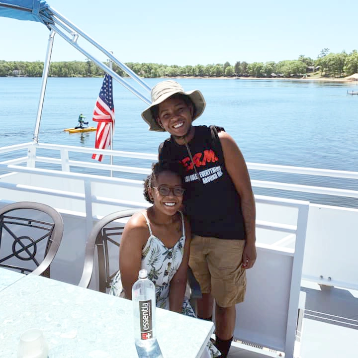 Photo of a mom and son smiling on board Gull Lake Cruises on a summer day