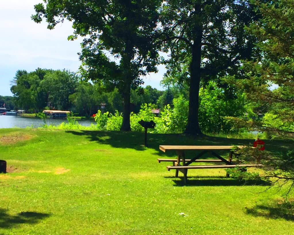Crosby Memorial Park on a summer day picnic area and lake in the background
