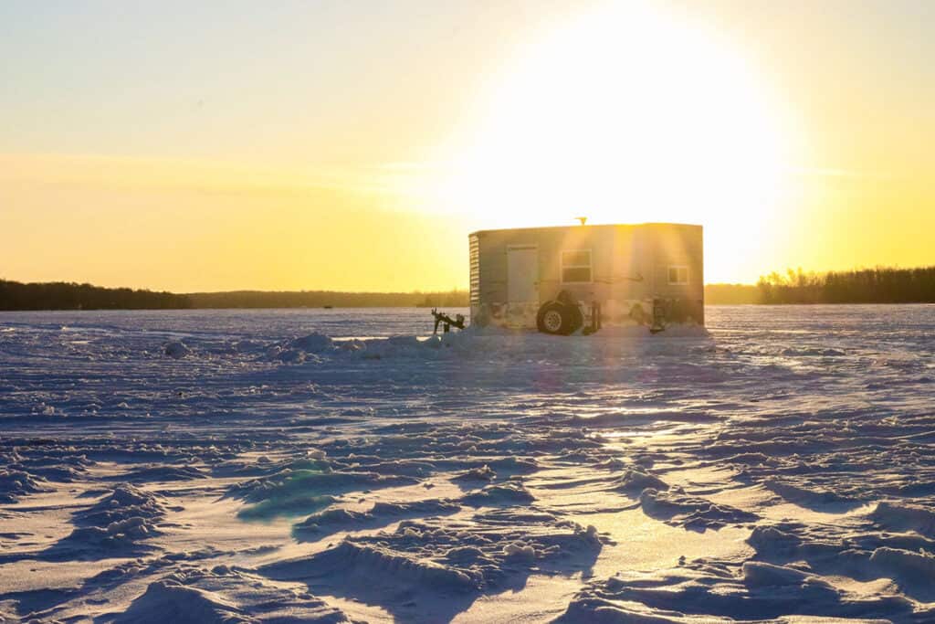 Photo of an Ice Castle Fishouse on the ice at sunset at Ruttger's Bay Lake Resort