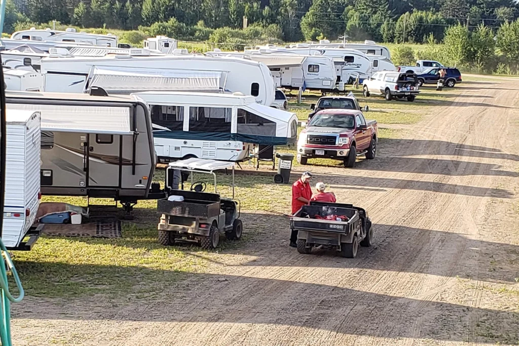 Campsite at Paul Bunyan Land with many RVs on a summer day copy