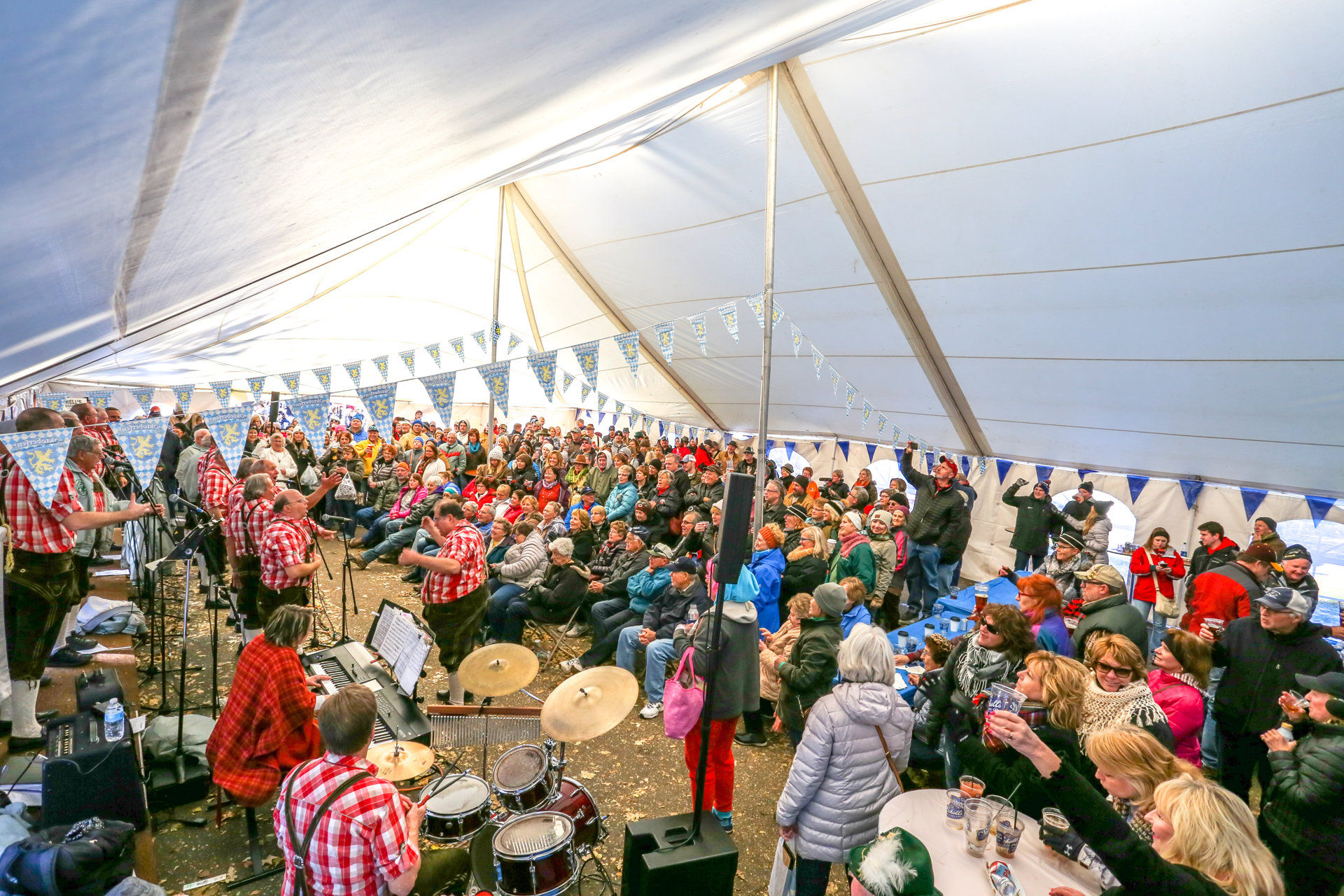 Crowds gather under a large festival tent during Ruttger’s Oktoberfest at Ruttger’s Bay Lake Resort.